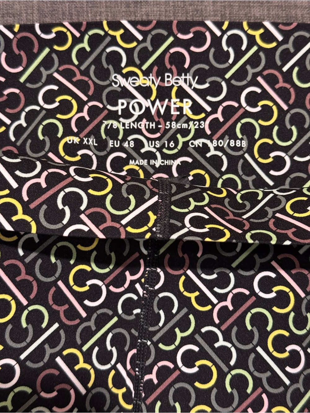 Sweaty Betty Black Leggings with Pastel Ring Print